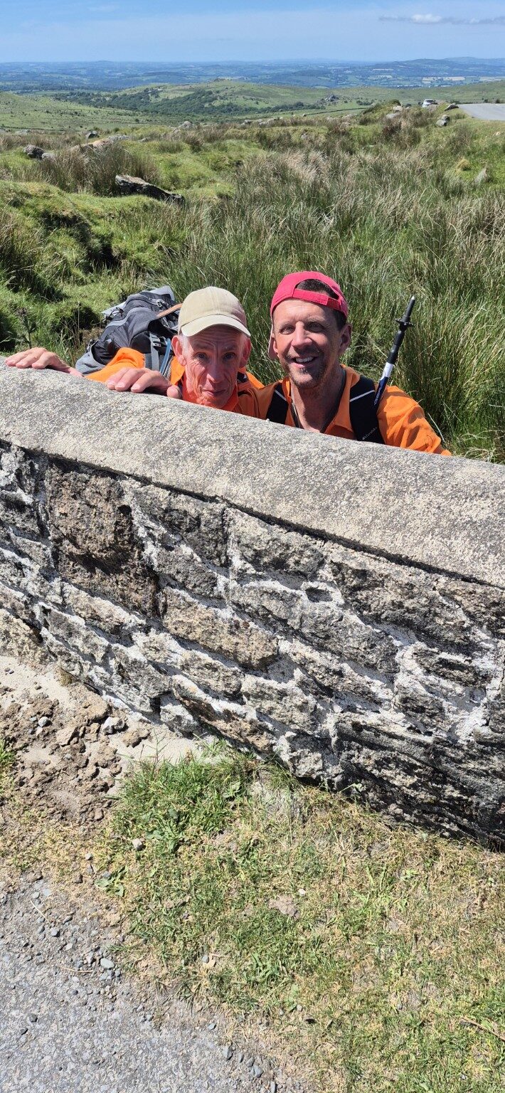 John and Barry looking over a stone wall on Dartmoor